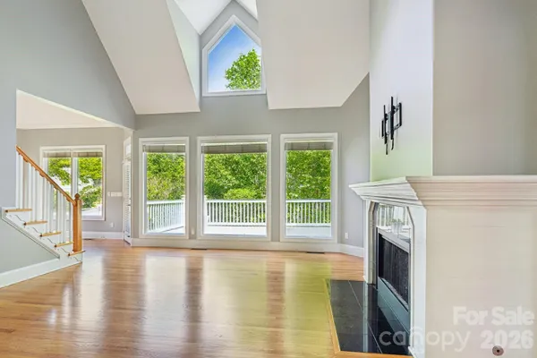 a view of an entryway with wooden floor