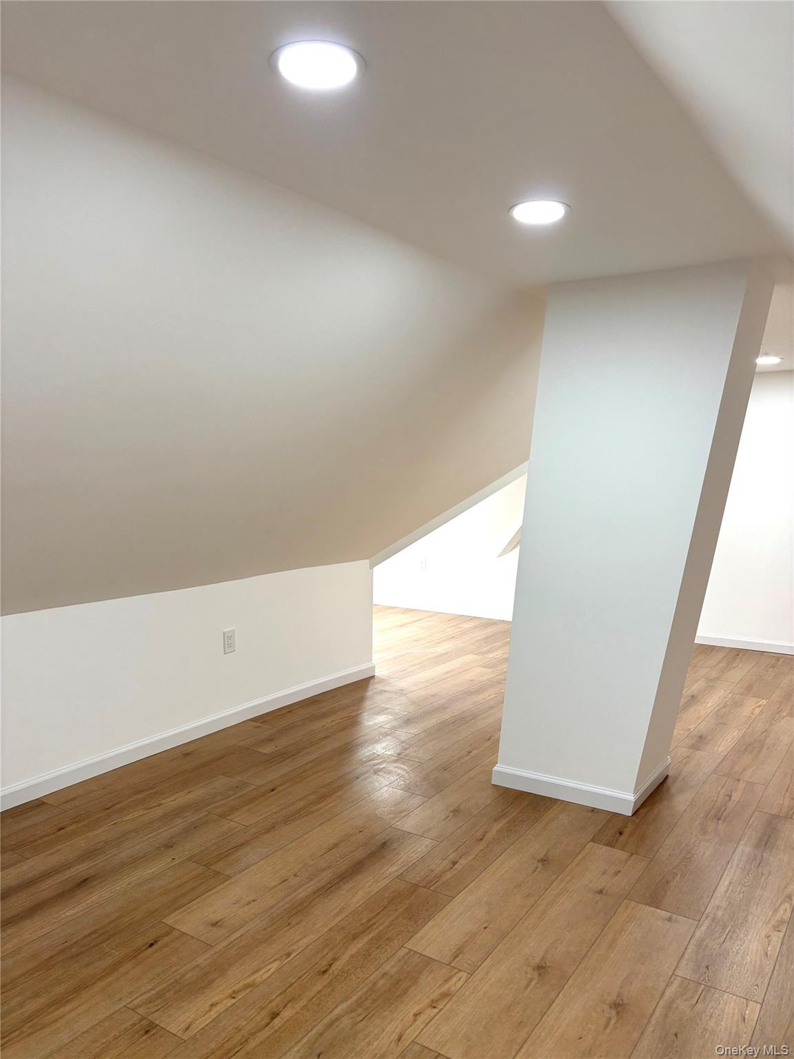 558 Locust Avenue, Unit 2 Port Chester, NY 10573 - Photo 9 of 11 a view of an empty room and wooden floor