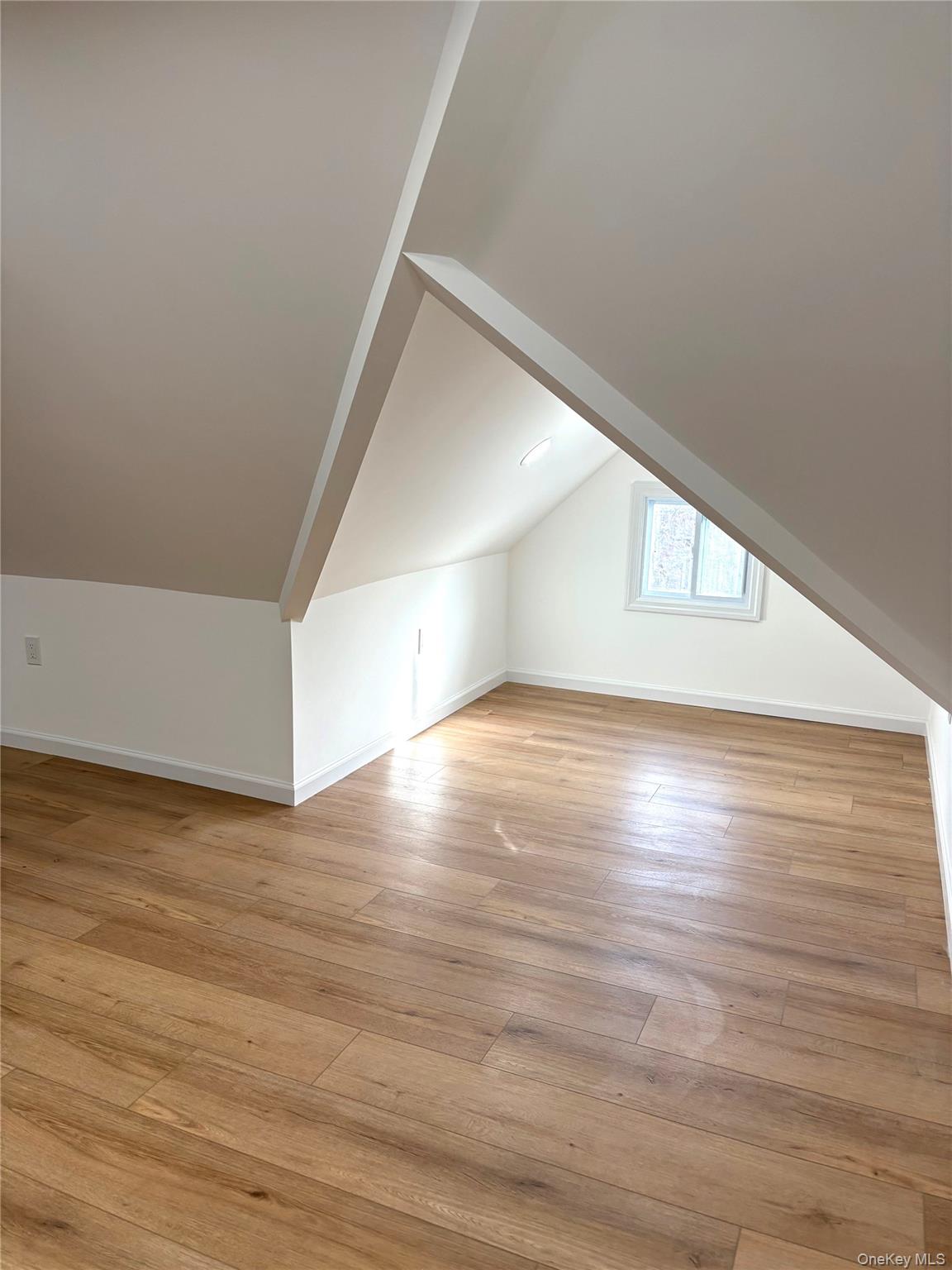 558 Locust Avenue, Unit 2 Port Chester, NY 10573 - Photo 10 of 11 a view of a big room with wooden floor