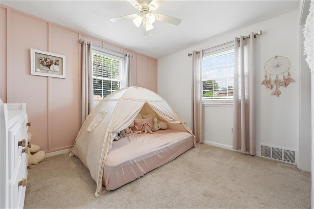 129 Meadowbrook Road Renfrew, PA 16053 - Photo 15 of 45 a spacious bedroom with a bed and a window