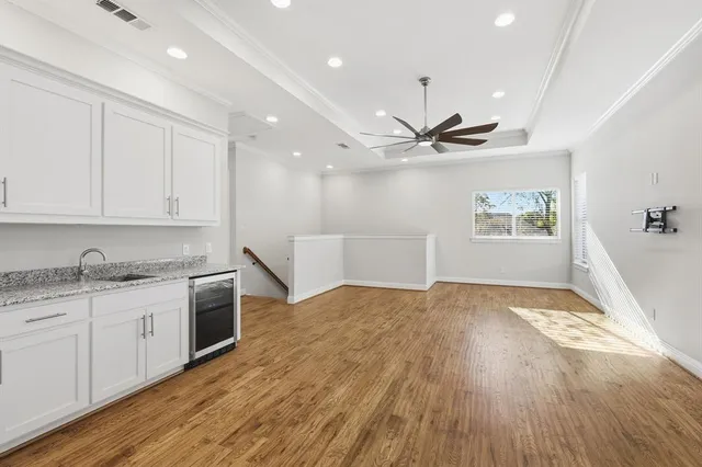 a view of kitchen with sink and wooden floor