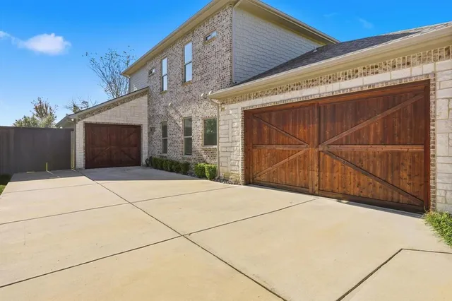 a view of backyard with garage