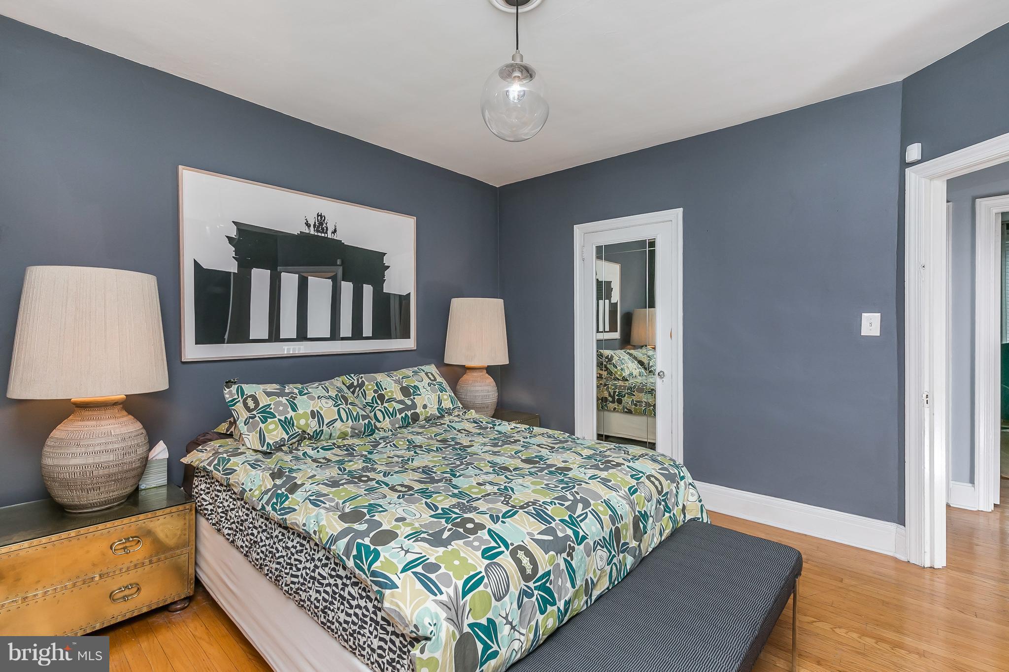 3622 Kimble Road Baltimore, MD 21218 - Photo 17 of 30 a bedroom with a bed and wooden floor