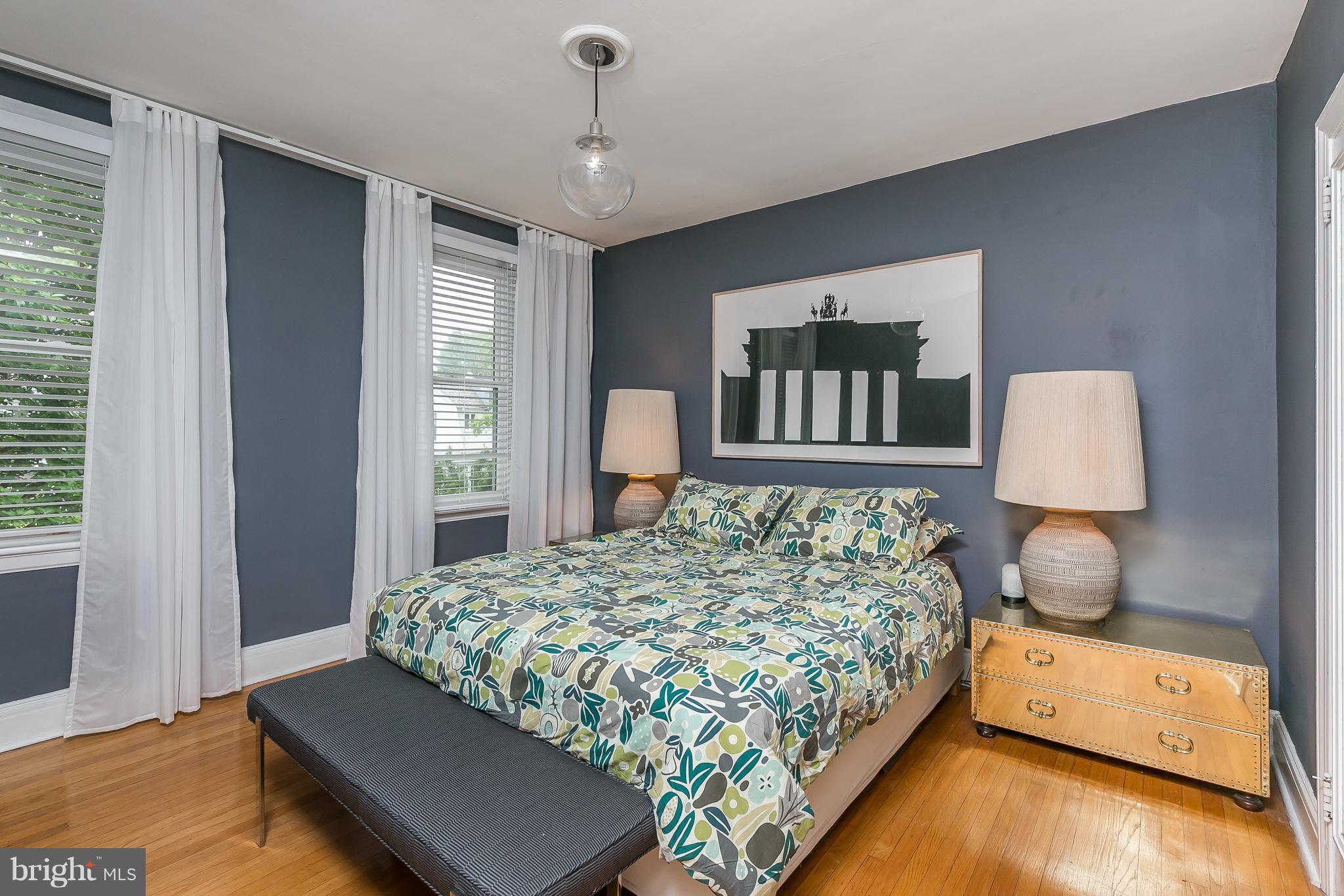 3622 Kimble Road Baltimore, MD 21218 - Photo 18 of 30 a bedroom with a bed and wooden floor