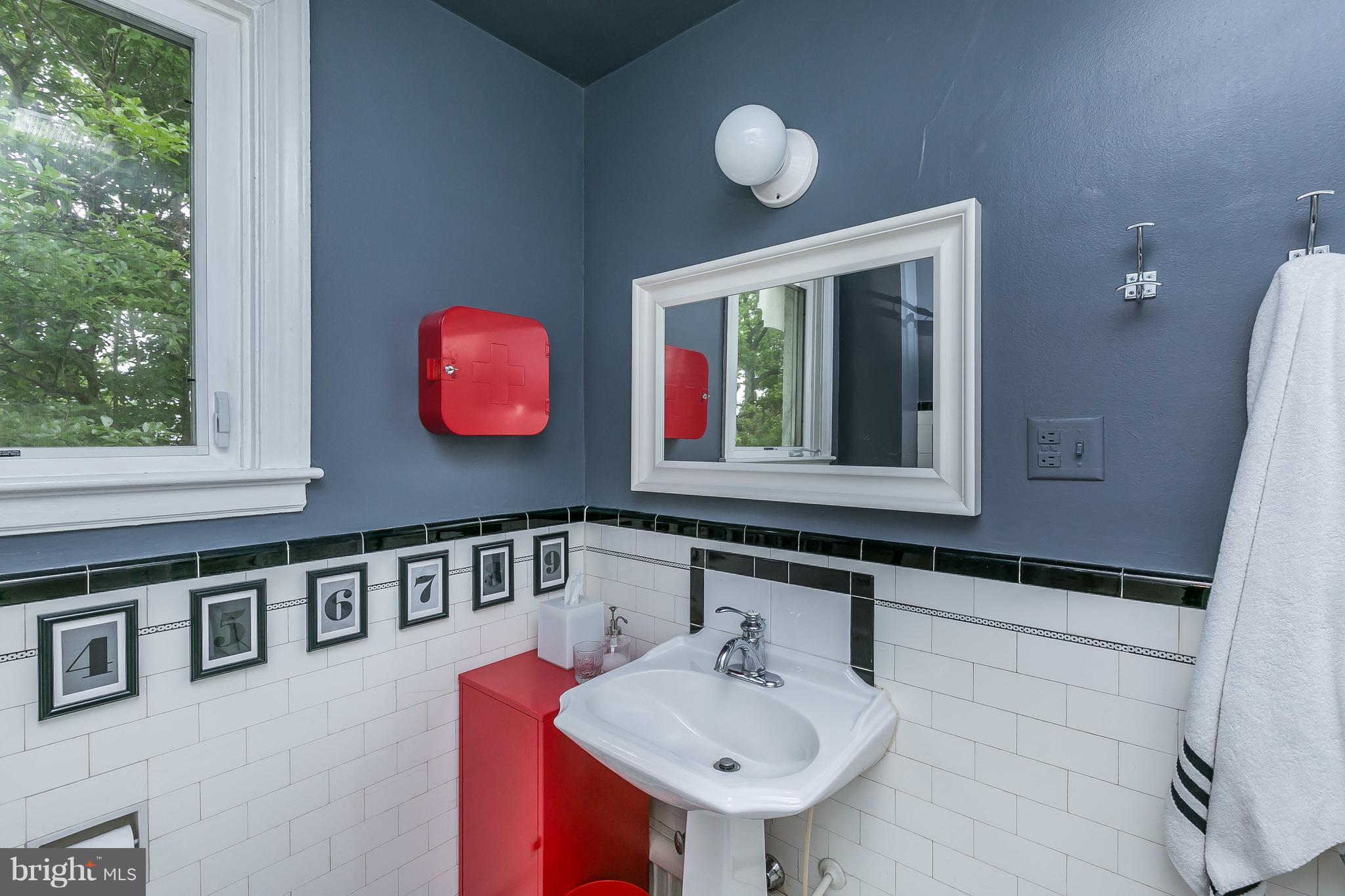 3622 Kimble Road Baltimore, MD 21218 - Photo 23 of 30 a bathroom with a sink and a mirror