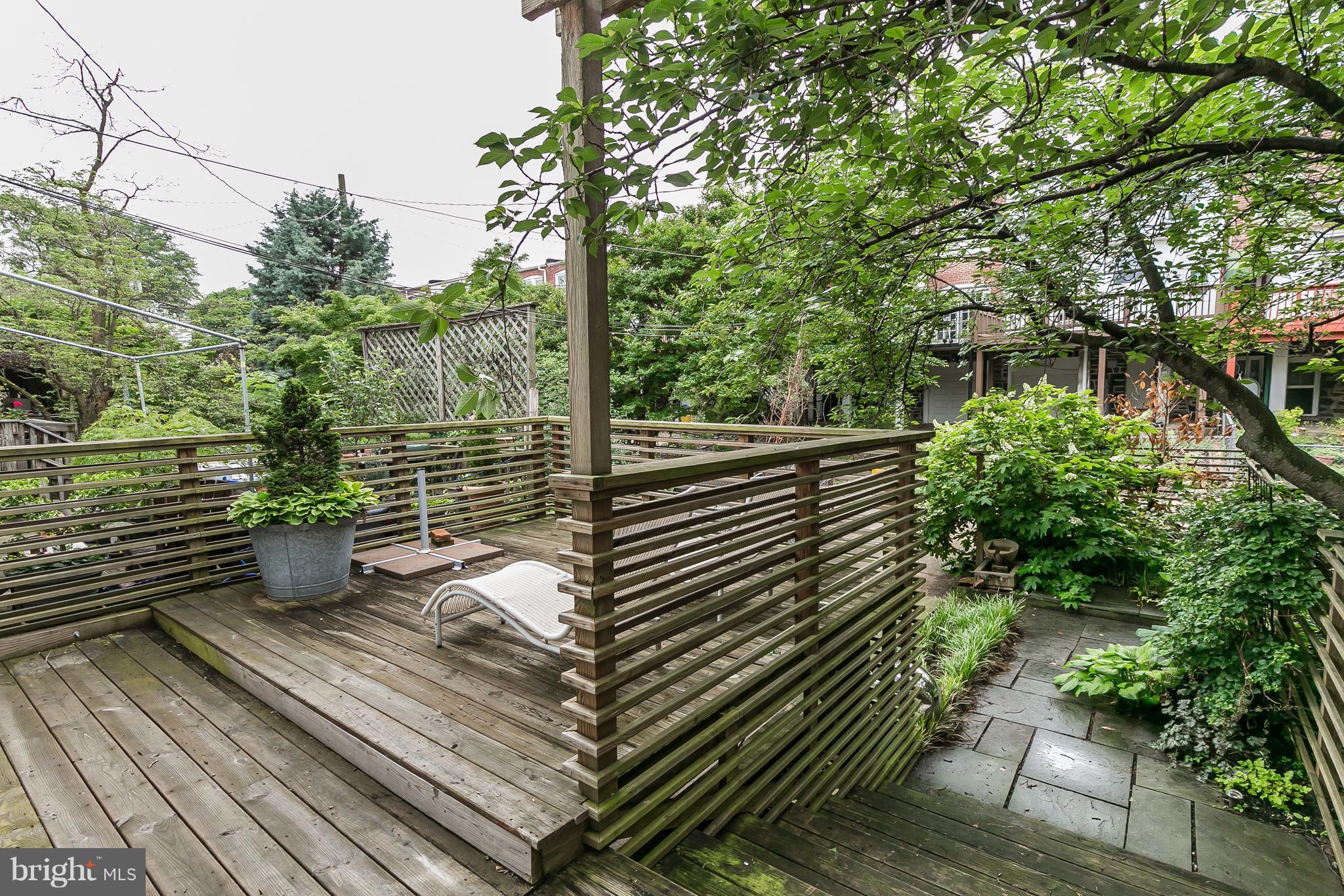 3622 Kimble Road Baltimore, MD 21218 - Photo 26 of 30 a view of a balcony with chairs and wooden fence