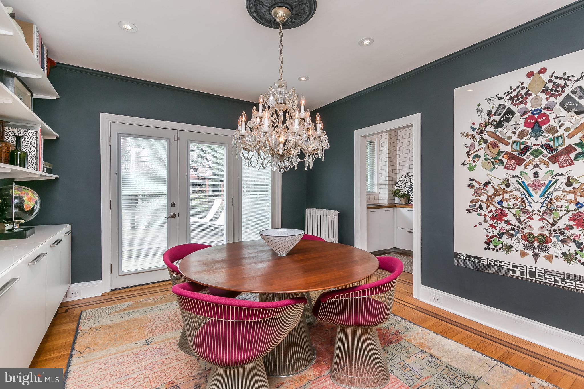 3622 Kimble Road Baltimore, MD 21218 - Photo 9 of 30 a dining room with furniture a rug and a chandelier