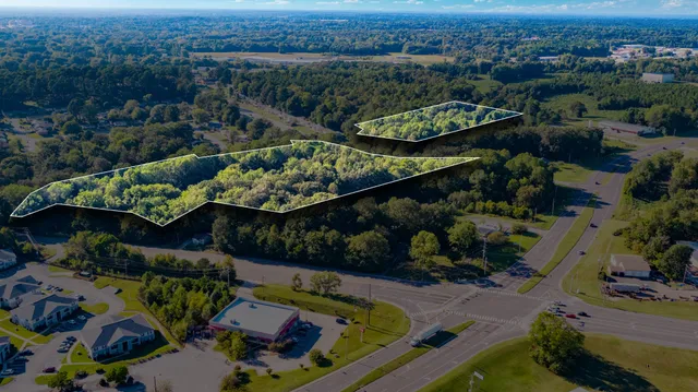 an aerial view of a house with a garden