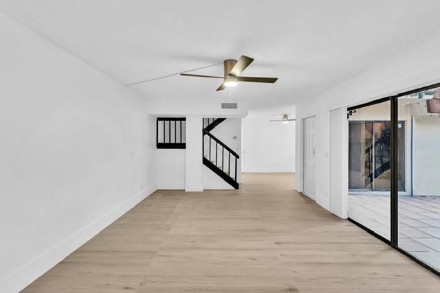 3305 Spanish Wells Drive, Unit 41B Delray Beach, FL 33445 - Photo 2 of 13 a view of entryway and hall with wooden floor