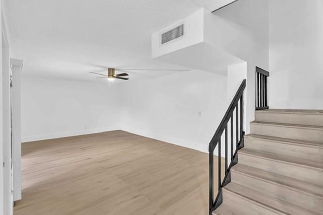 3305 Spanish Wells Drive, Unit 41B Delray Beach, FL 33445 - Photo 6 of 13 a view of a hallway with staircase