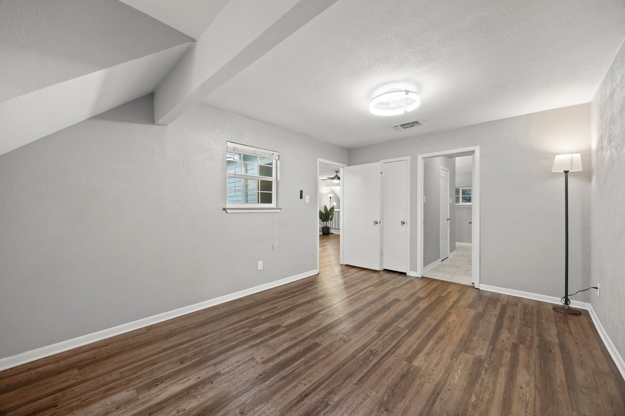 8330 Fathom Circle, Unit 501 Austin, TX 78750 - Photo 17 of 26 a view of an empty room with wooden floor