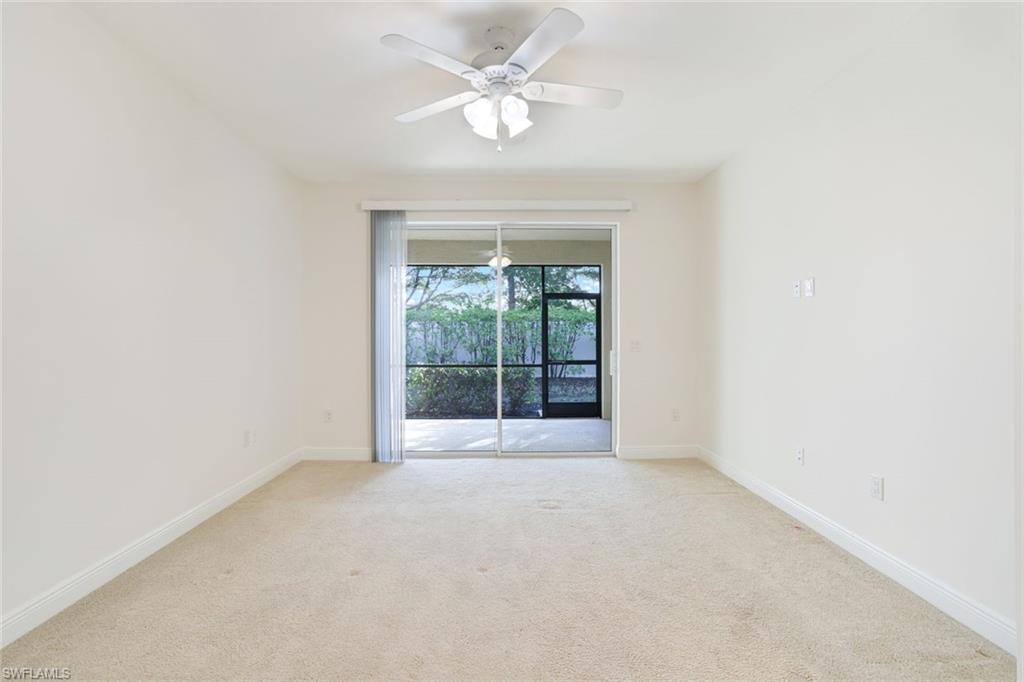 13366 Kent Street Naples, FL 34109 - Photo 11 of 23 Empty room featuring light colored carpet and ceiling fan