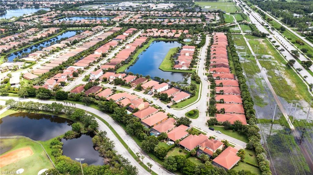 13366 Kent Street Naples, FL 34109 - Photo 3 of 23 Aerial view of property and surrounding area featuring a nearby body of water and nearby suburban area