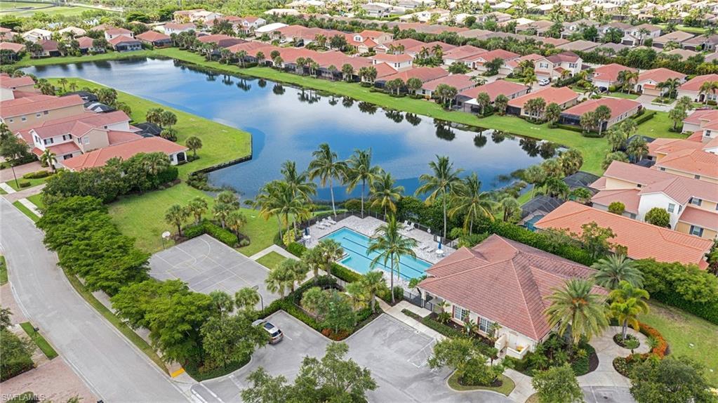 13366 Kent Street Naples, FL 34109 - Photo 4 of 23 Aerial perspective of suburban area featuring a nearby body of water and a pool area