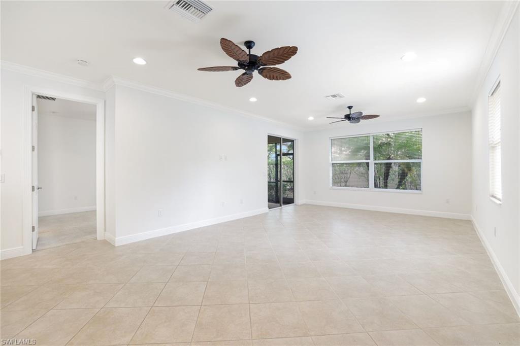 13366 Kent Street Naples, FL 34109 - Photo 7 of 23 Empty room featuring ornamental molding, recessed lighting, a ceiling fan, and light tile patterned flooring