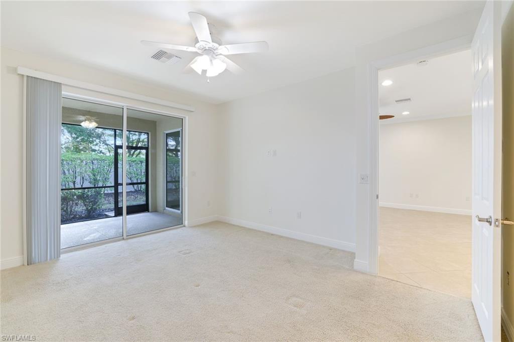 13366 Kent Street Naples, FL 34109 - Photo 10 of 23 Unfurnished room with light carpet, a ceiling fan, and recessed lighting