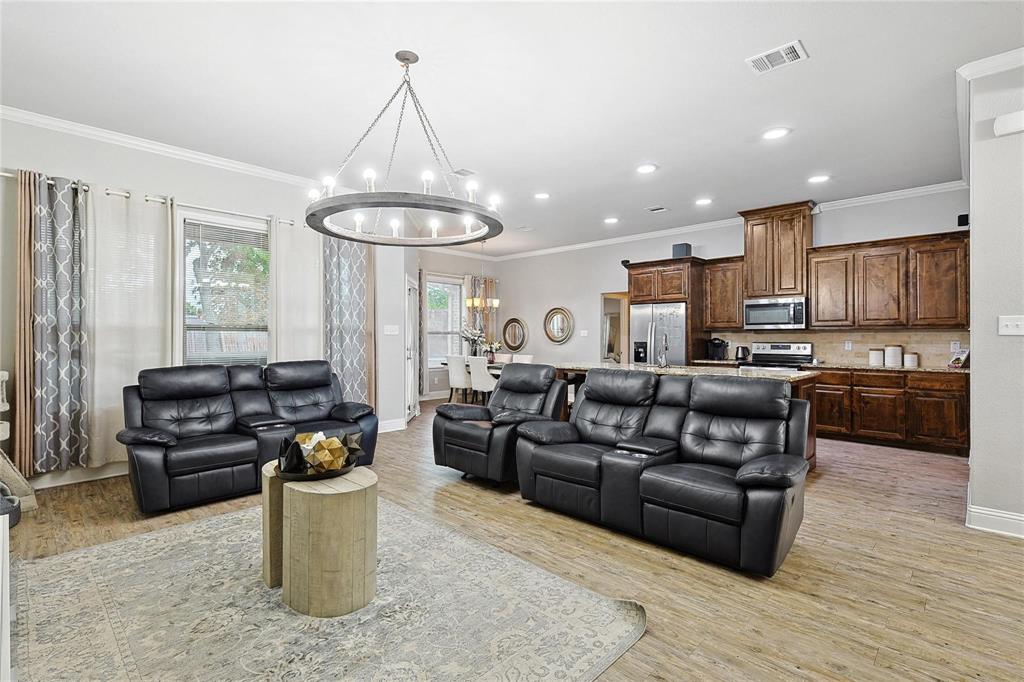 342 West Huffman Street Krum, TX 76249 - Photo 13 of 25 a living room with furniture and a kitchen view