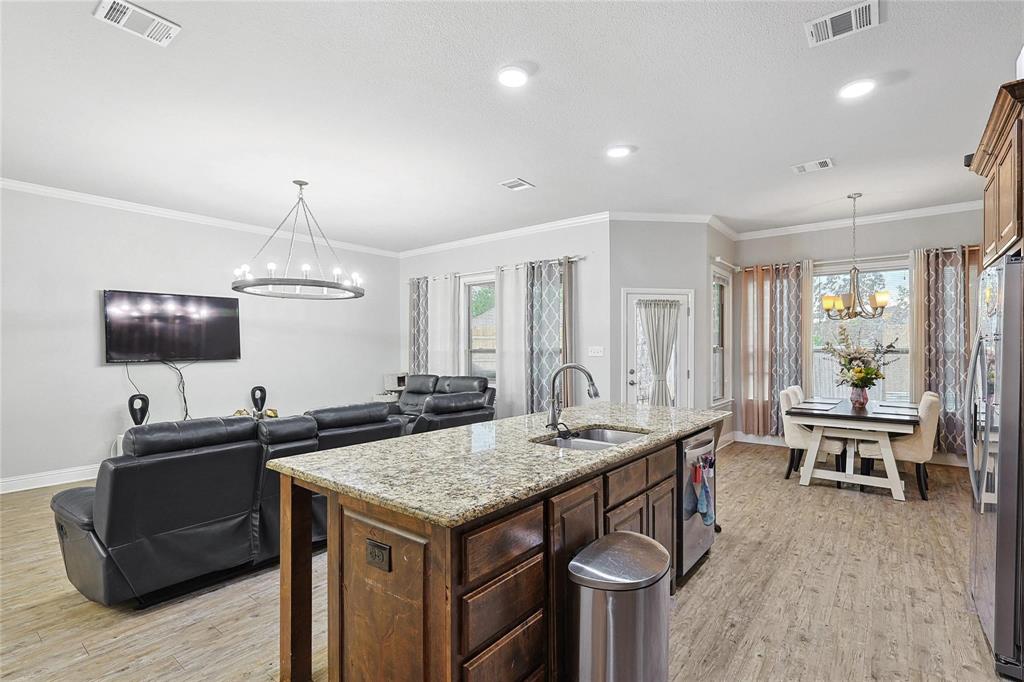 342 West Huffman Street Krum, TX 76249 - Photo 21 of 25 a kitchen with a table and chairs in it