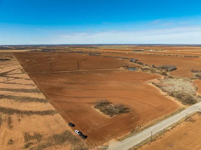 a view of a lake with houses in the back