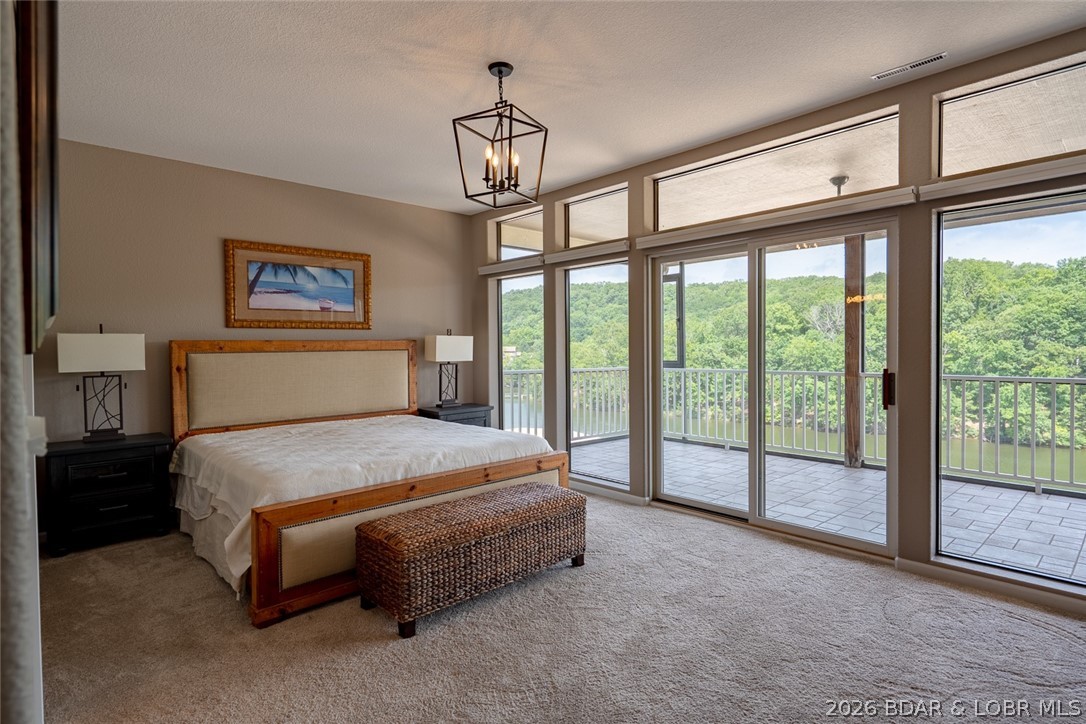 611 Lazy Days Road, Unit R7 Osage Beach, MO 65065 - Photo 16 of 38 Master Suite