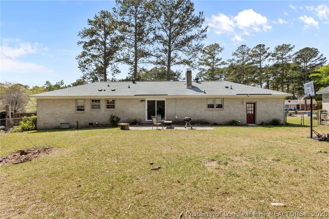 908 Ruton Court Fayetteville, NC 28303 - Photo 27 of 29 a front view of a house with a yard and garage