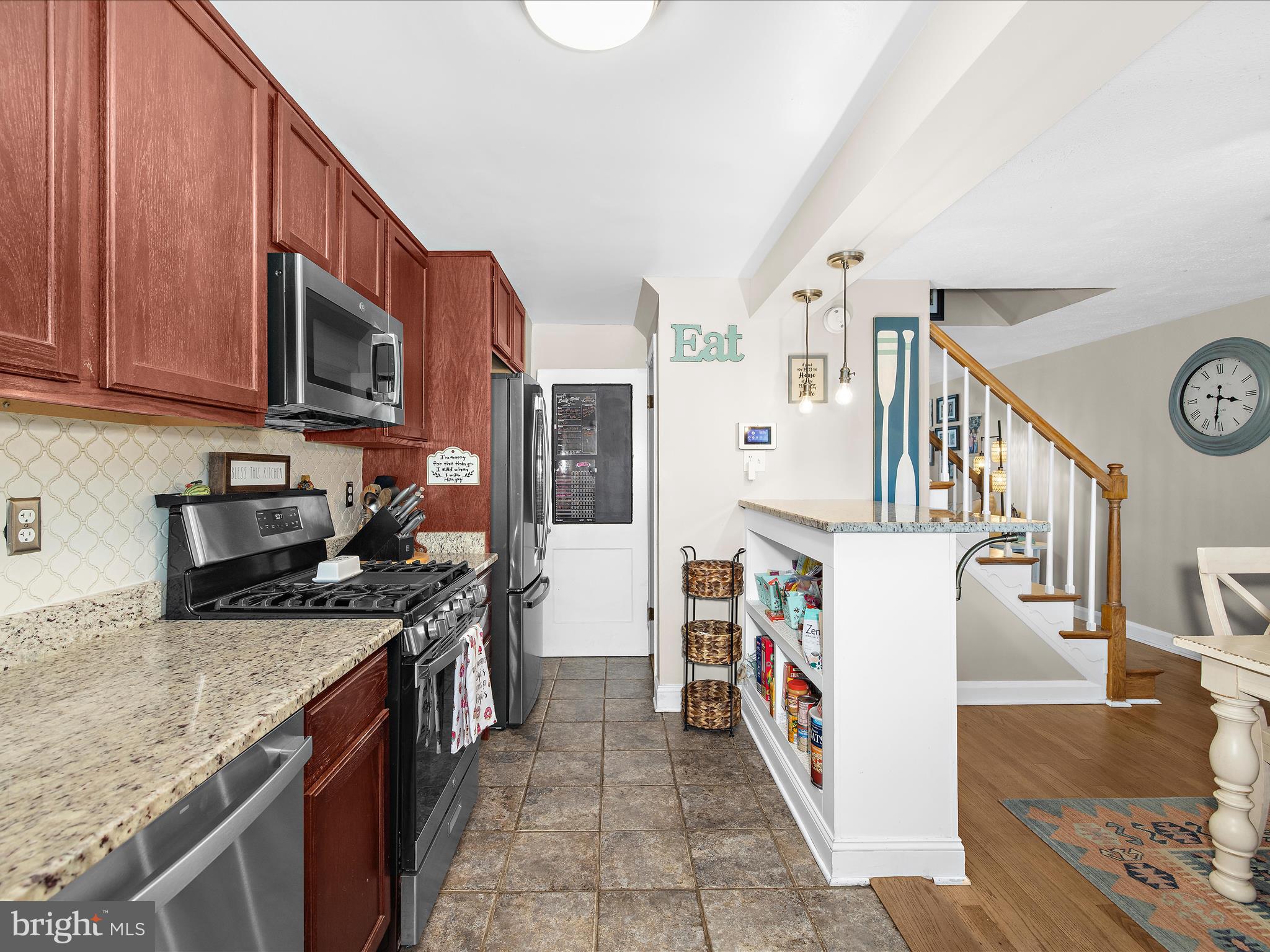 7851 Kentley Road Baltimore, MD 21222 - Photo 15 of 58 a kitchen with stainless steel appliances granite countertop a stove a sink and a refrigerator