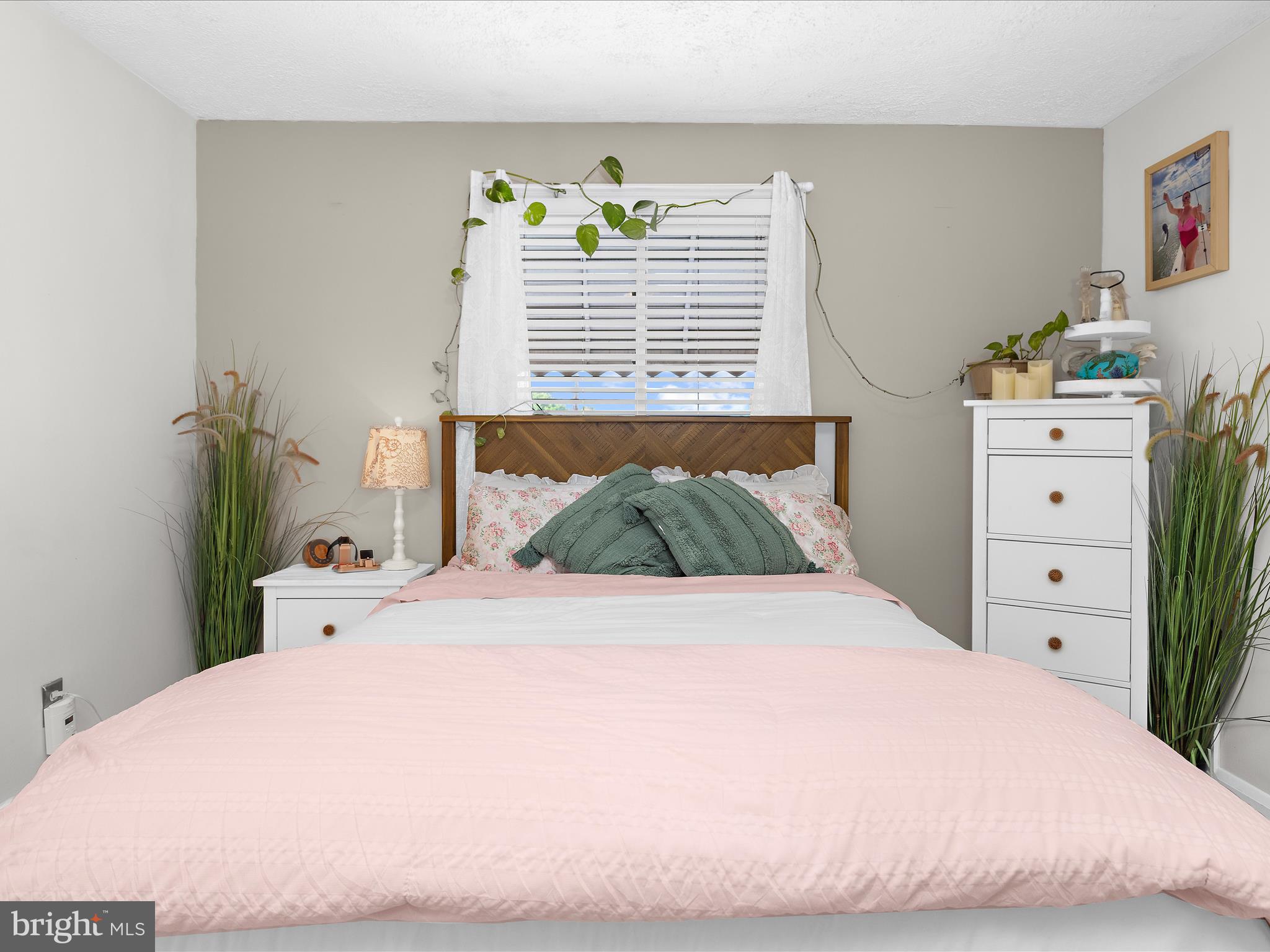 7851 Kentley Road Baltimore, MD 21222 - Photo 25 of 58 a bedroom with a bed and a window