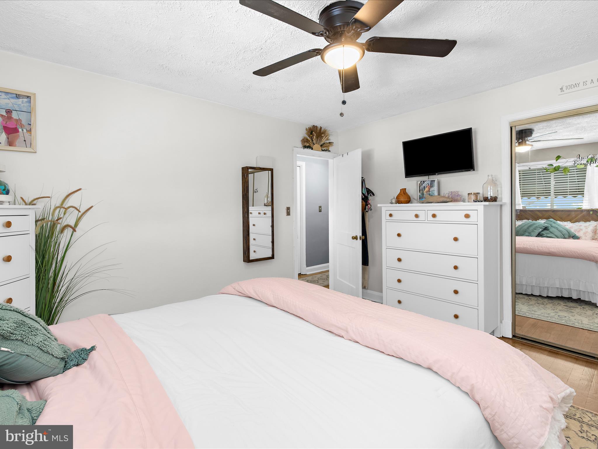 7851 Kentley Road Baltimore, MD 21222 - Photo 26 of 58 a bedroom with a bed and a flat screen tv