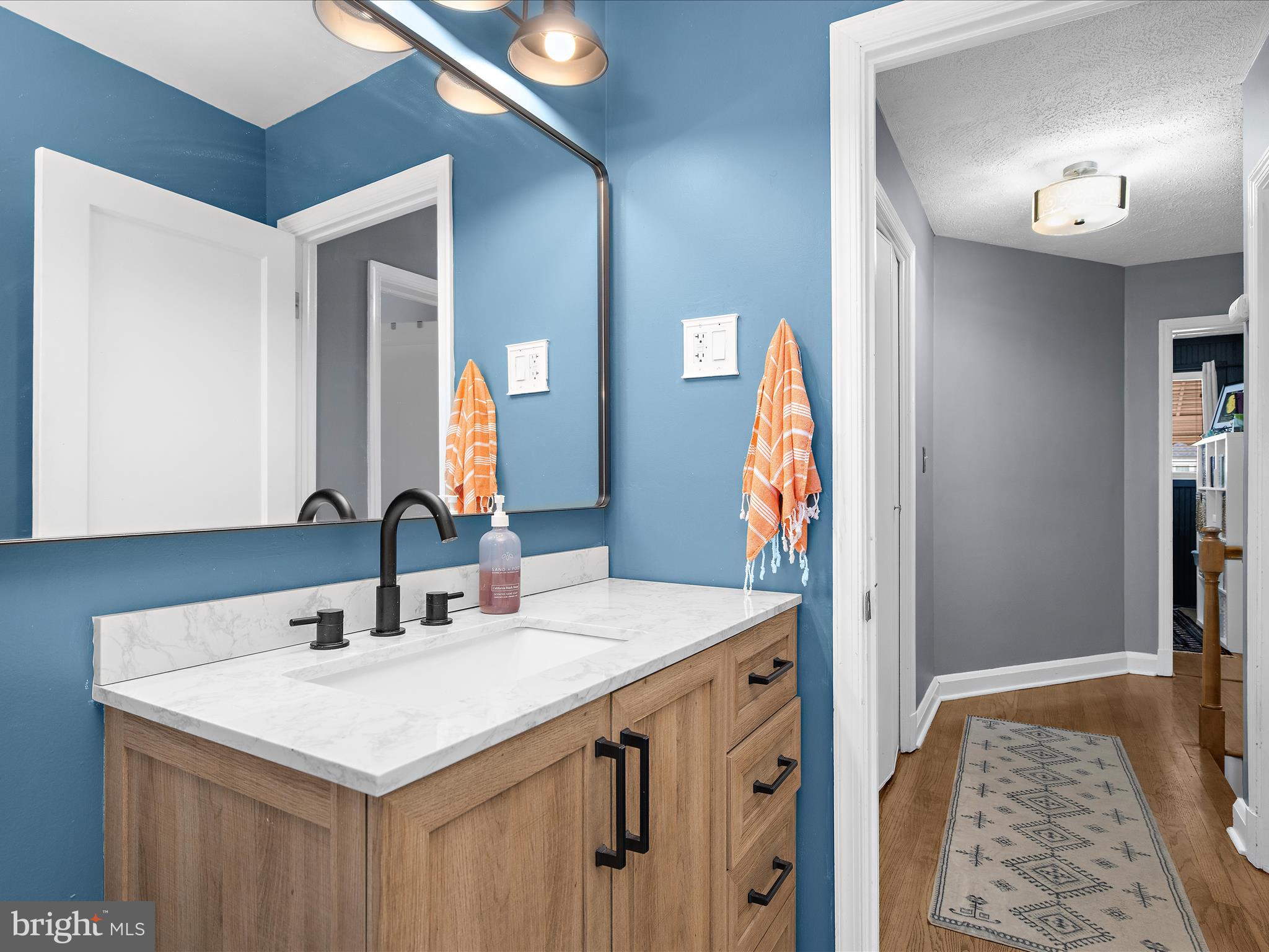 7851 Kentley Road Baltimore, MD 21222 - Photo 27 of 58 a bathroom with a sink and a mirror