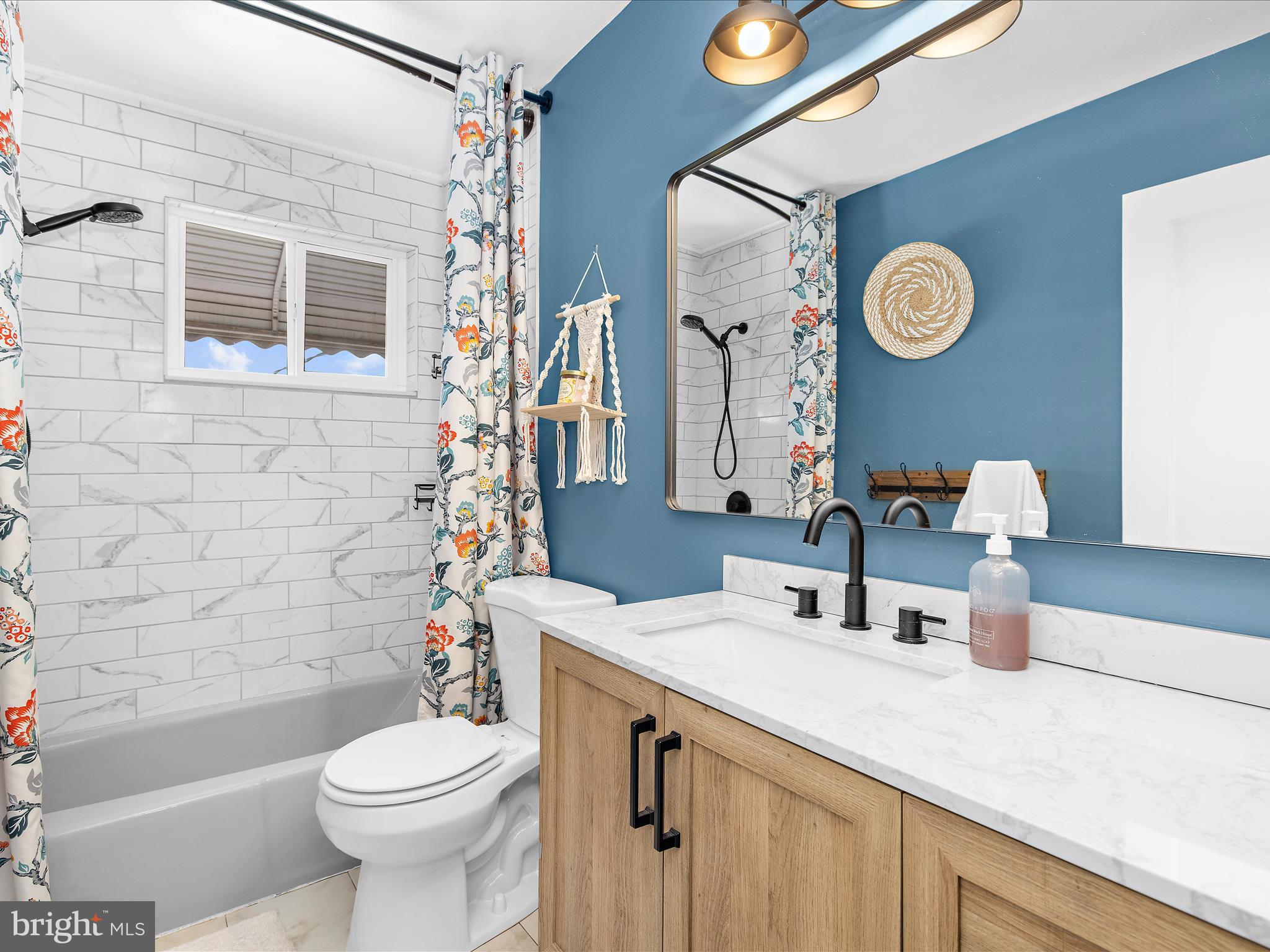 7851 Kentley Road Baltimore, MD 21222 - Photo 29 of 58 a bathroom with a sink a toilet and a mirror