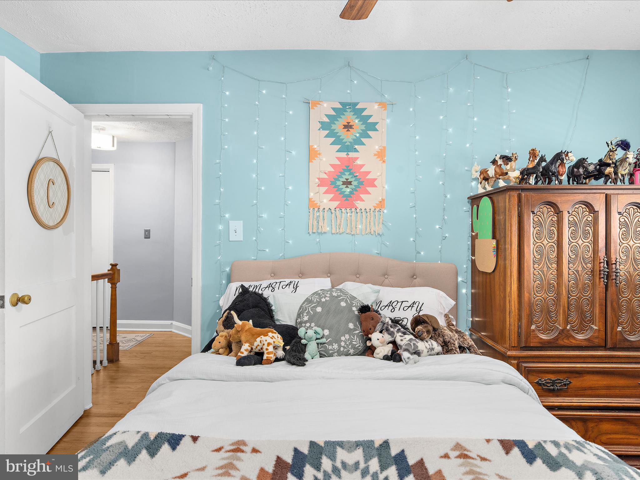 7851 Kentley Road Baltimore, MD 21222 - Photo 30 of 58 a bedroom with bed and wooden floor