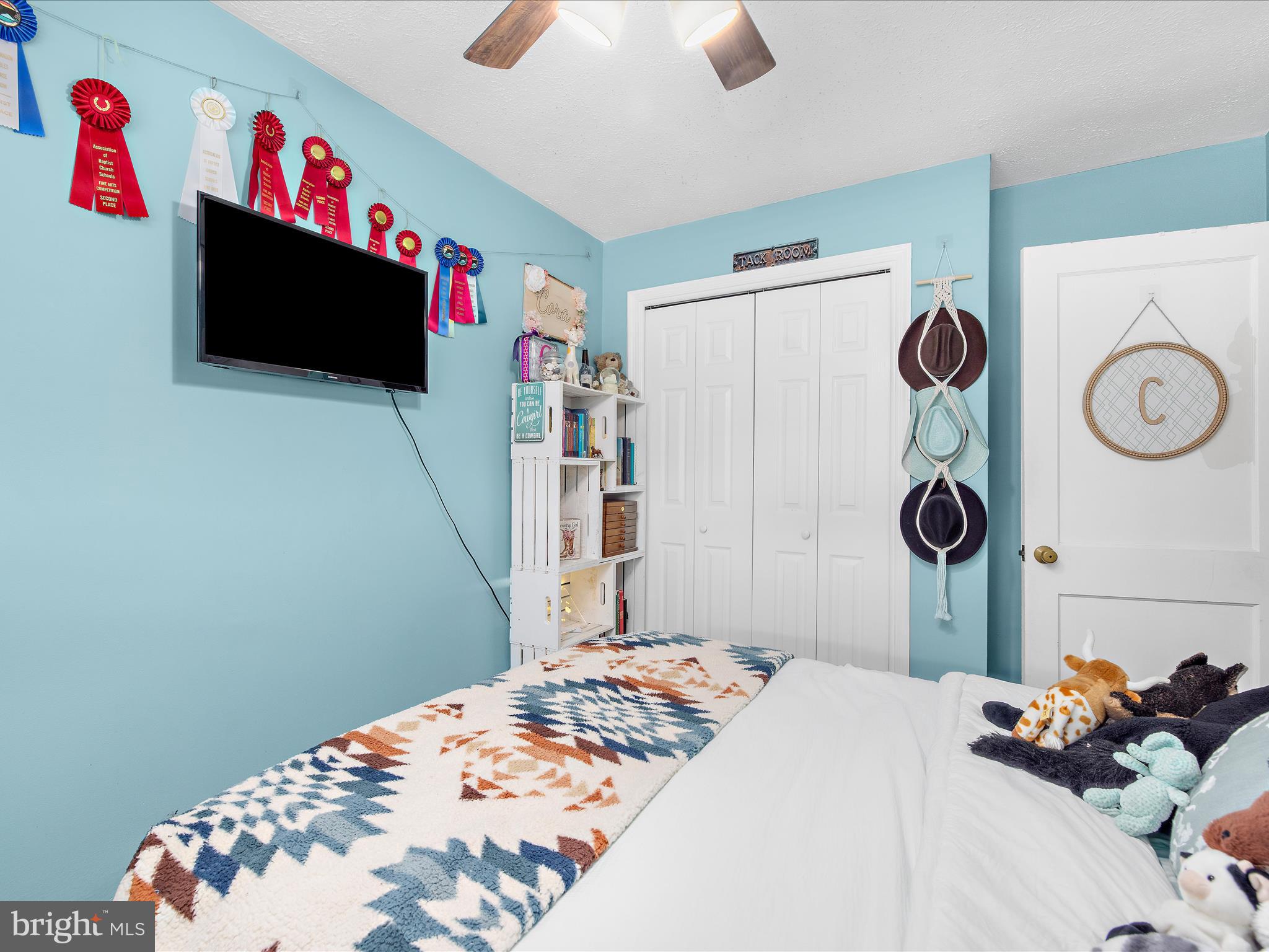 7851 Kentley Road Baltimore, MD 21222 - Photo 32 of 58 a bedroom with a bed and a flat screen tv