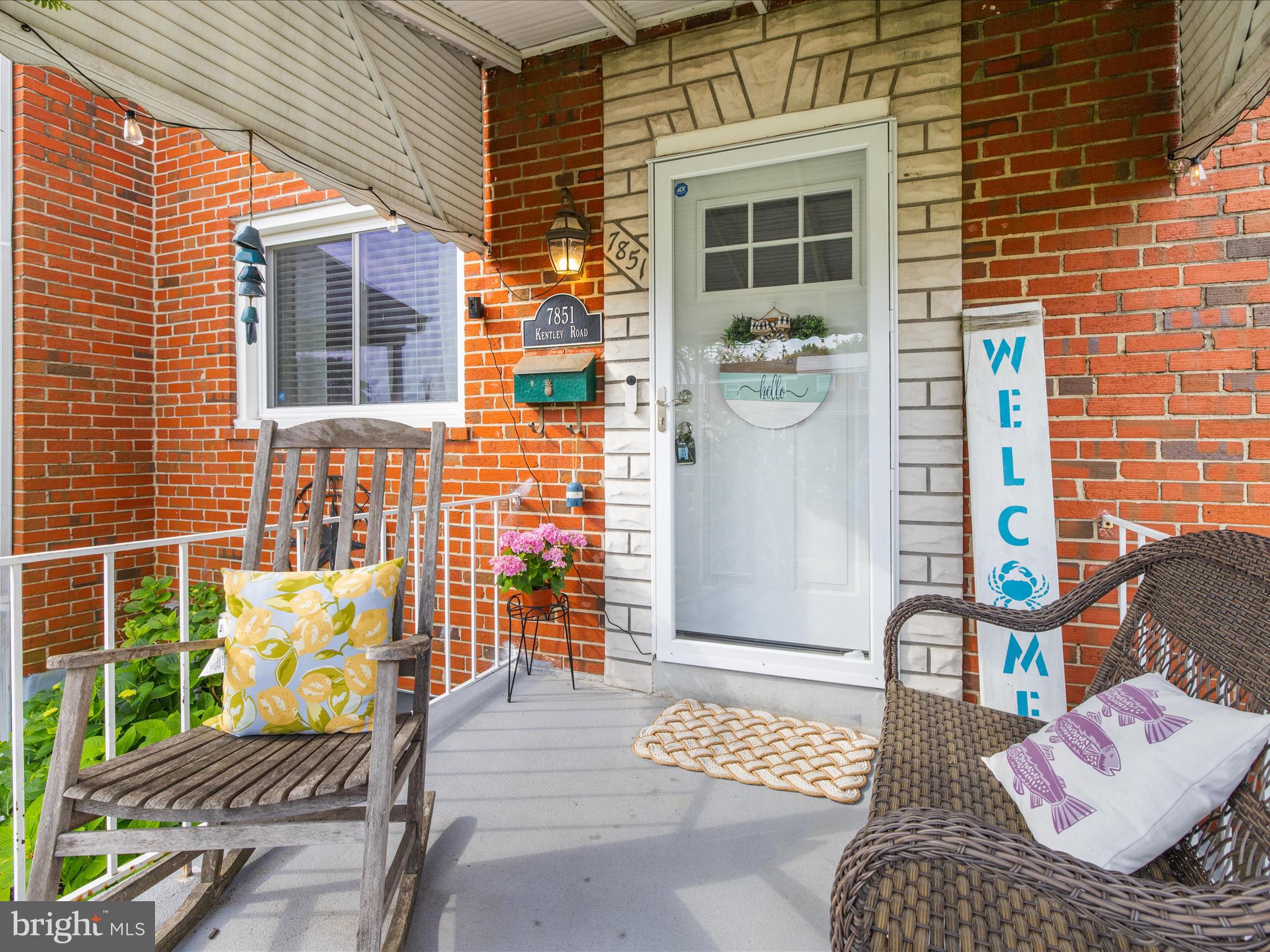 7851 Kentley Road Baltimore, MD 21222 - Photo 4 of 58 a front view of a house with outdoor seating