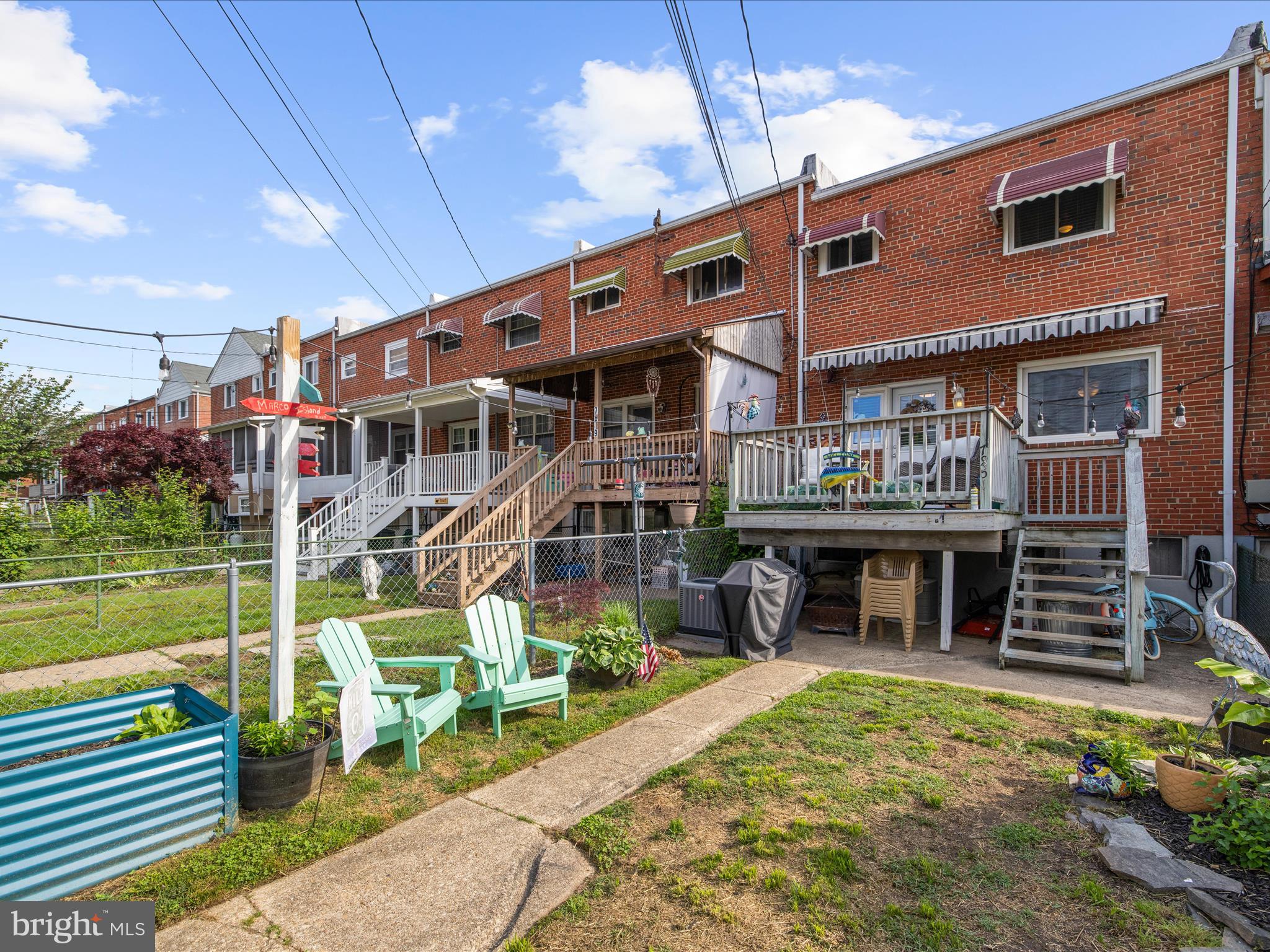 7851 Kentley Road Baltimore, MD 21222 - Photo 48 of 58 a front view of a house with a yard table and chairs