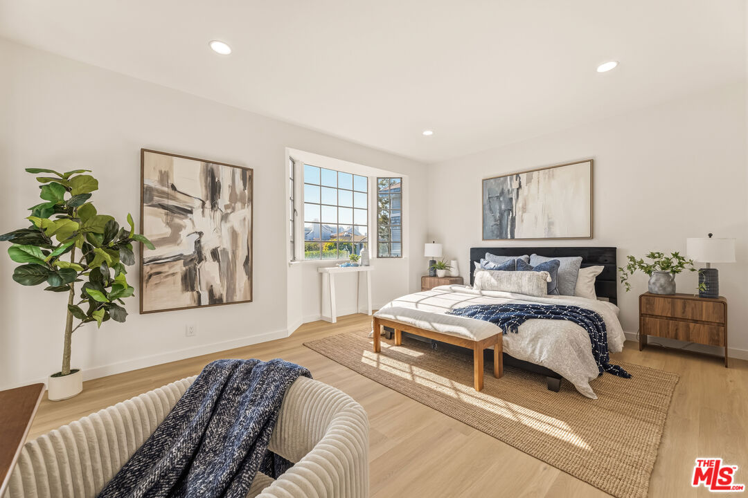 311 Bora Bora Way, Unit 3207 Marina del Rey, CA 90292 - Photo 21 of 54 a spacious bedroom with a bed and a window
