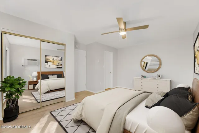 a bedroom with bed and windows