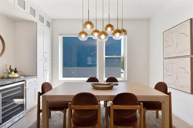 a view of a dining room with furniture and window
