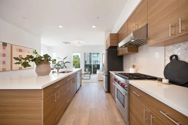 a kitchen with a stove and cabinets