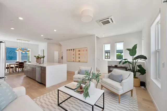 a bedroom with a bed and a painting