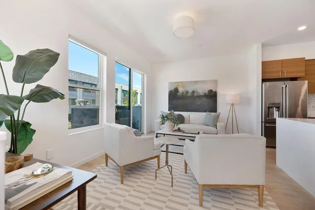 a bedroom with a bed and a couch