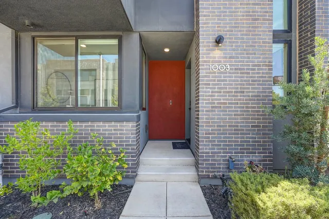 a view of room with window and wooden floor