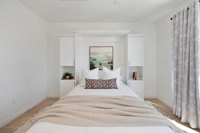 front view of a brick house with a yard