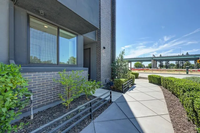 front view of a brick house with a yard