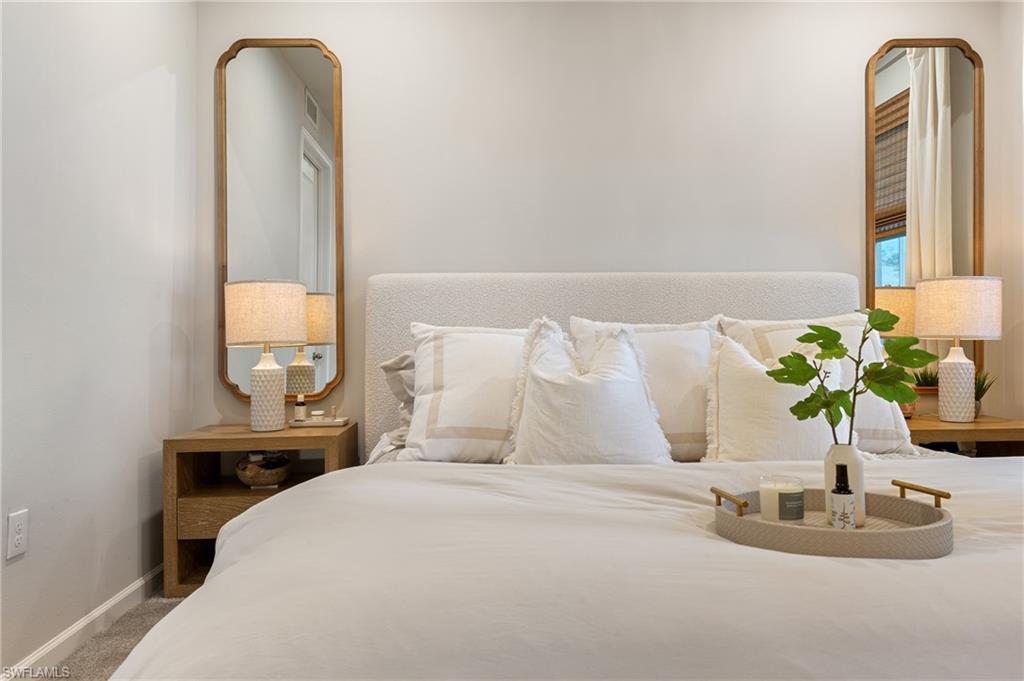 4638 Arboretum Circle, Unit 102 Naples, FL 34112 - Photo 9 of 20 a bedroom with a bed and a window