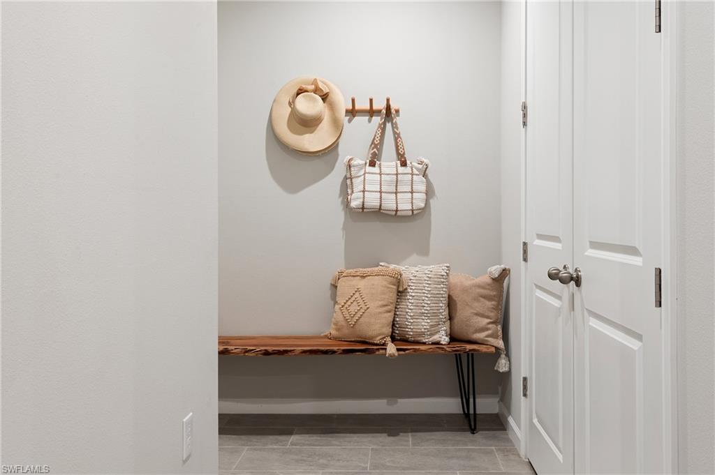 4638 Arboretum Circle, Unit 102 Naples, FL 34112 - Photo 17 of 20 a room with storage and a window