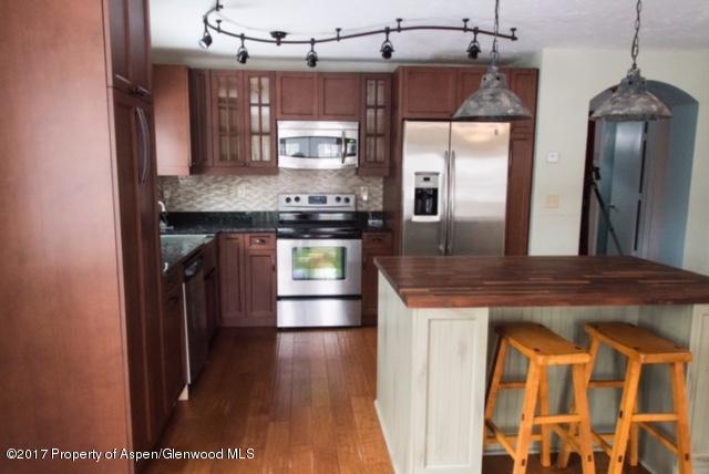 50 Riversedge Court Basalt, CO 81621 - Photo 16 of 19 a kitchen with stainless steel appliances granite countertop a sink a stove and a refrigerator