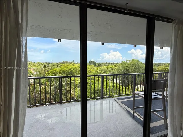 a view of a glass door with a view from a window