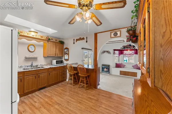 a kitchen with stainless steel appliances granite countertop a stove and cabinets