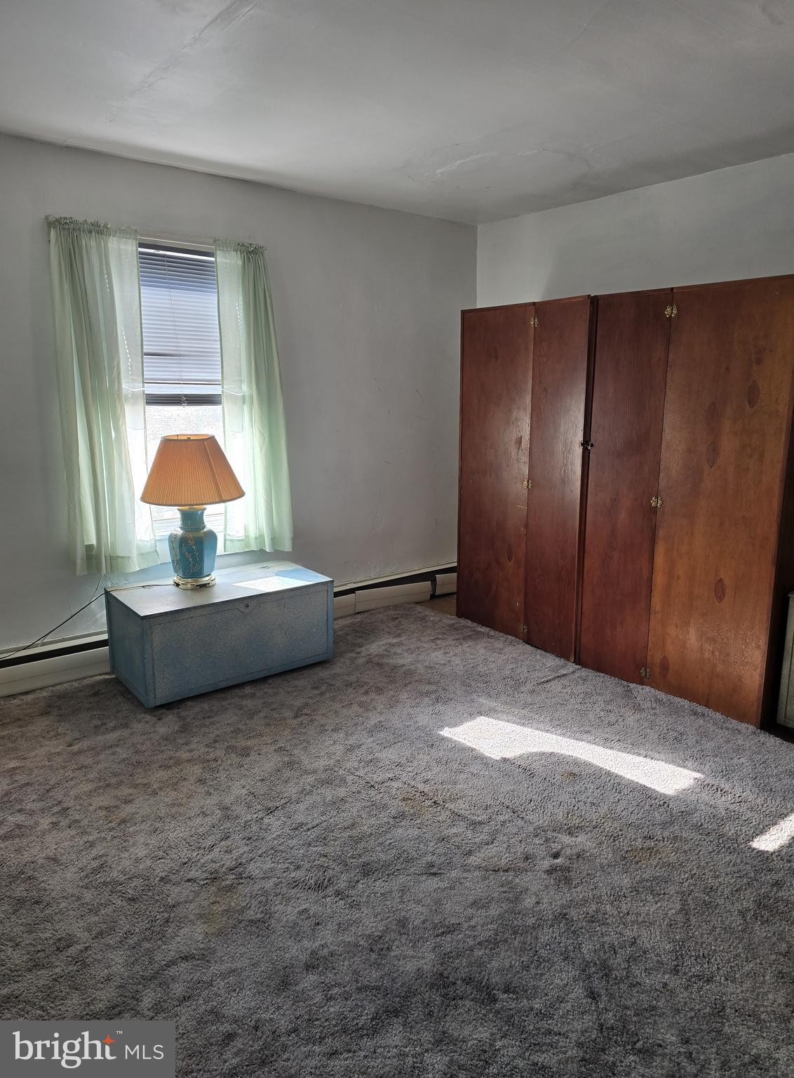 115 South Lightner Street Union Bridge, MD 21791 - Photo 10 of 19 a view of an empty room with a fireplace and a window