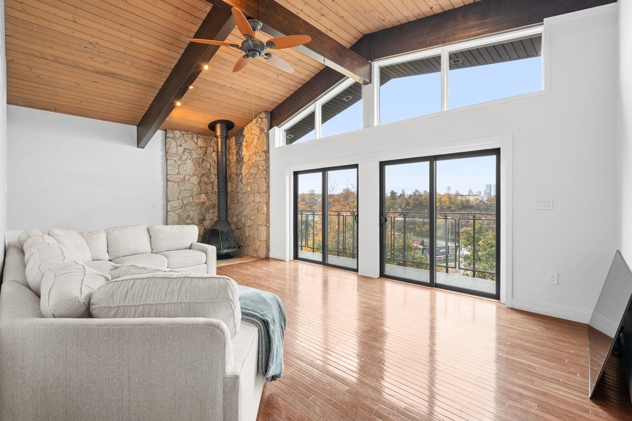 76 Hackensack Plank Road Weehawken, NJ 07086 - Photo 14 of 44 a living room with furniture and large windows